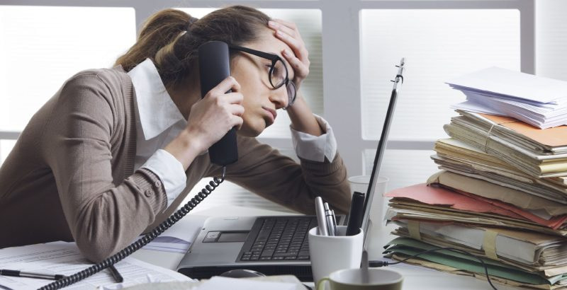 What causes a stressful work environment?
