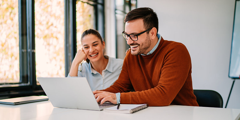Couple looking at open enrollment options.
