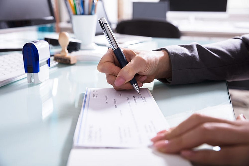 Employee works on union payroll processing.
