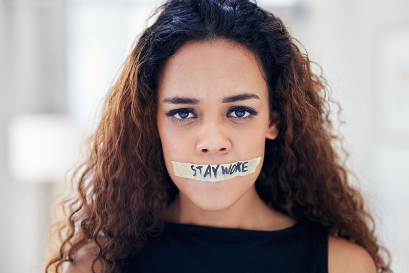 Gender, violence and portrait of woman with silence, tape on mouth and fight for equality in human rights. Attention, change and girl in protest to stop sexual harassment in woke revolution at home