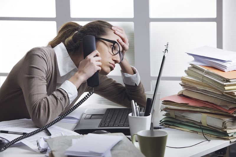 What causes a stressful work environment?