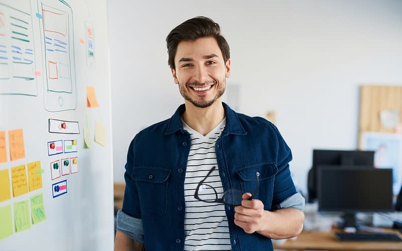 Smiling Solvo Global employee working on programing