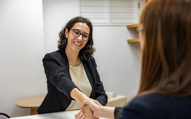 HR leader reviewing candidate screening results and time-to-fill metrics to improve quality of hire in a tight labor market
