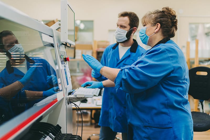 Quality control team working in production factory